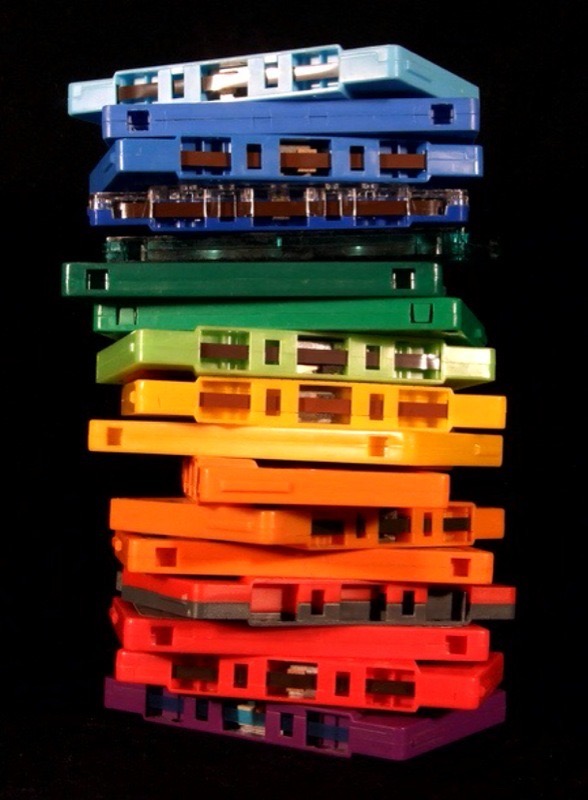 A stack of rainbow-colored cassette tapes.